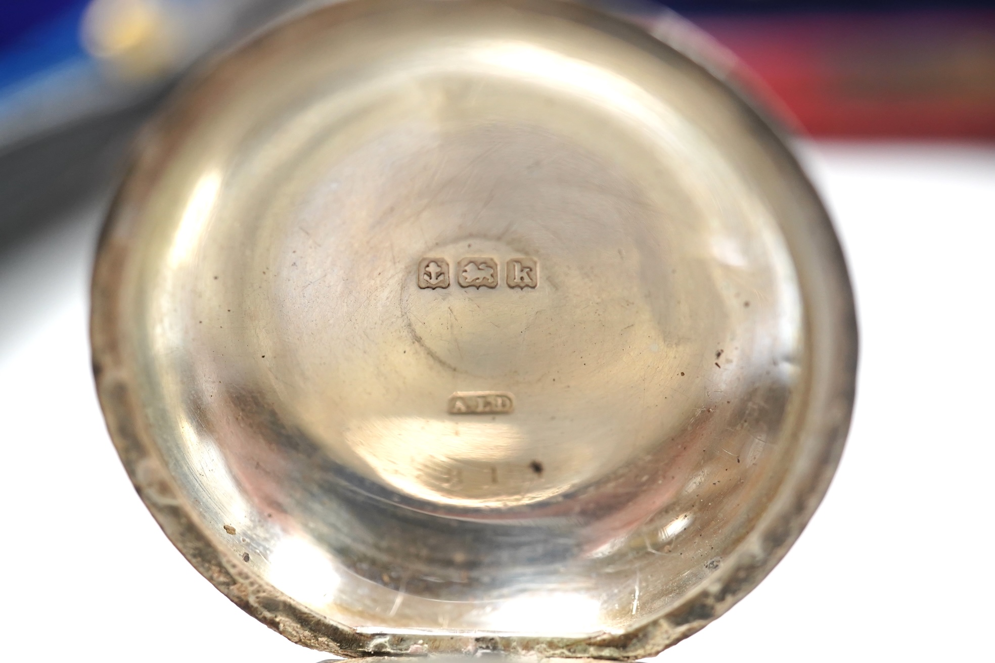 A George V Brittania standard silver two handled cup, Thomas Bradbury & Sons, Sheffield, 1922, height 49mm, two associated sections of a travelling watch case, with an Elkington nickel cased pocket watch, an Edwardian en